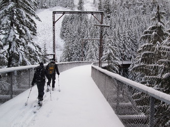 A party of skiers on the old railroad trestle over Hansen Creek.