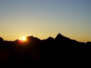 Sunrise over Summit Chief Mountain from summit of Big Snow Mountain