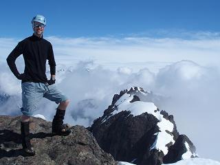 Chip on the summit of The Brothers, N peak in background