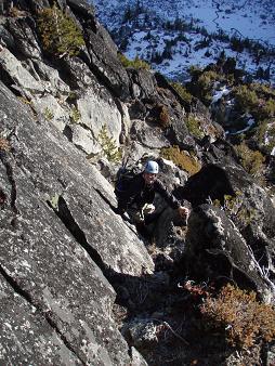 Descending the 3rd class dihedral near the summit of Dudley Spire
