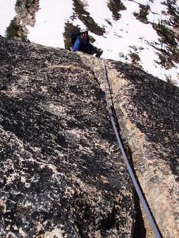 Ian ascending the first of the SW buttress's two slabby pitches