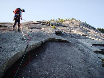 Lori rapping down The Pillar to the second Lost Charms belay station