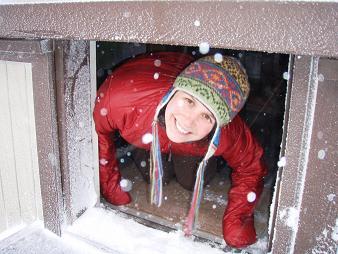 Lindsay looking out of the only part of the Thorp Mountain lookout door that would open