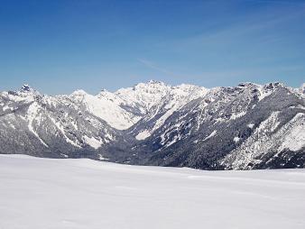 Gold Creek valley over a cornice on Roaring Ridge (Thompson, Alaska, Huckleberry, Chikamin, Alta, Rampart, Dungeon)