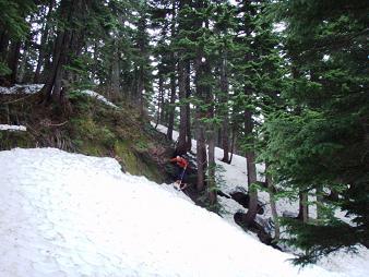 Steven does some spring dirt skiing on the way down