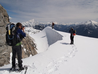 Three people taking photos of Kevin.  He placed himself in the optimal position for photography