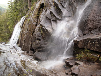 Bear Creek waterfalls between the road and the trail