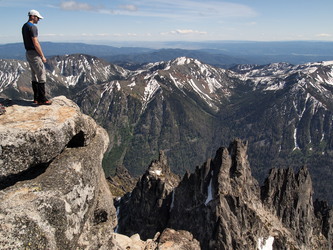 Brian on the summit of Little Annapurna, looking down at the Flagpole Needles.