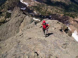 See that grumpy look on her face?  That is because we are re-ascending the alternate descent route.  I rapped to within 30 meters of the ground, only to discover that this descent route requires a double-rope rappel.  Our guide book didn't mention that...