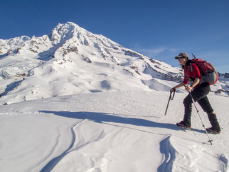 On the summit of Pyramid Peak, after a steep, icy climb.  The crampon on Lindsay's left foot is falling off.