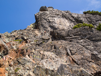 We arrived at the notch just as this Mountaineers party of four was finishing roping up. They climbed the route in two pitches with a belay at the rap station on the ledge.