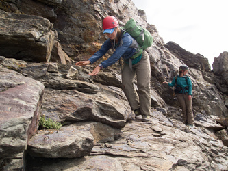 Descending the slabby ledges that lead up to the gully.