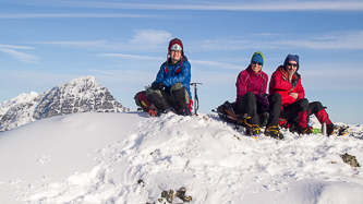 Yana, Carla, and Matt on the summit with Sloan Peak peeking out from behind.