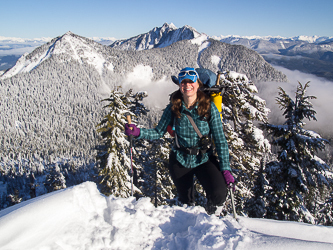 Lindsay on the Summit of Higher Squire.  With Ulalach Peak and Jumbo Mountain in the background.