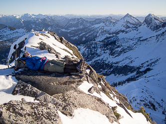 Yana being a marmot on the summit of Salish Peak.