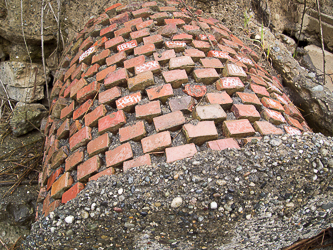 A brick-covered pipe?