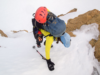 Front-pointing up frozen snow to the col.