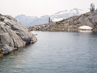 A lake between Granite Mtn and South Granite Mtn.  The Citadel and Mount Daniel on the horizon.