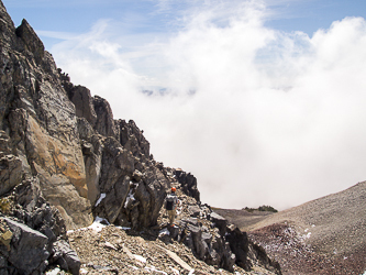 The short ledge that leads to the final summit scramble on Ives Peak's south side.