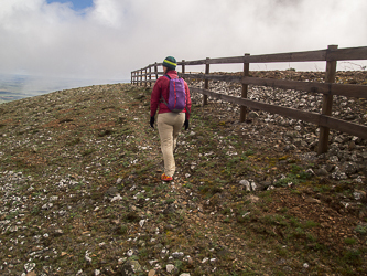 Circumnavigating the fence around the summit.