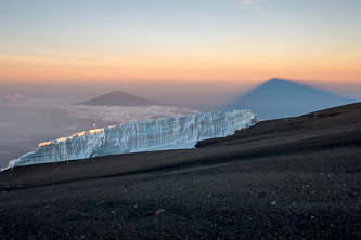 Mount Meru over the Southern Icefield and the shadow of Mount Kilimanjaro