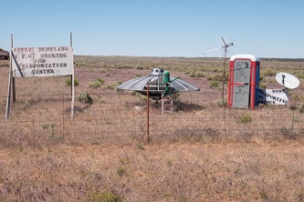 The sign says: "APPLE DUMPLING U.F.O. DOCKING AND TELEPORTATION CENTER"