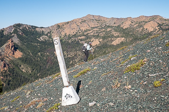 County Line marker with Earl Peak in the background