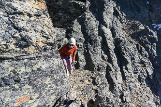 On the key ledge on the SW side of the ridge